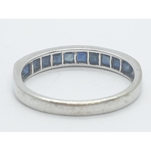 210 - 9ct white gold half eternity sapphire ring, weight 1.63g and size N