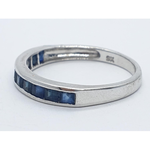 210 - 9ct white gold half eternity sapphire ring, weight 1.63g and size N