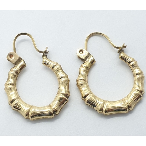 230 - Pair of 9ct gold horse shoe earrings