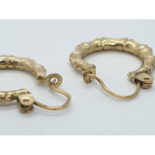 230 - Pair of 9ct gold horse shoe earrings