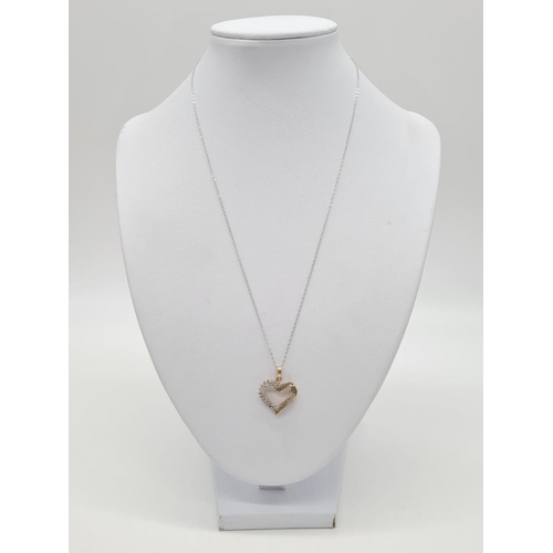 232 - 9ct gold diamond heart pendant on 46cm long 9ct gold chain, weight 2.2g and pendant 17mm long approx