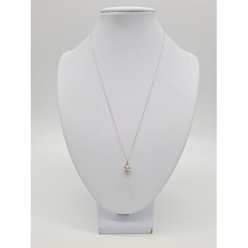 236 - 18ct white gold CZ stone pendant set on a 46cm long 9ct gold chain, weight 1.9g and pendant is 13mm ... 