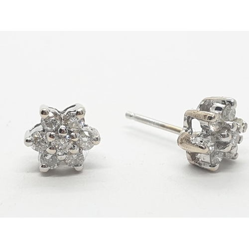 272 - 14ct white gold diamond stud earrings (no back)