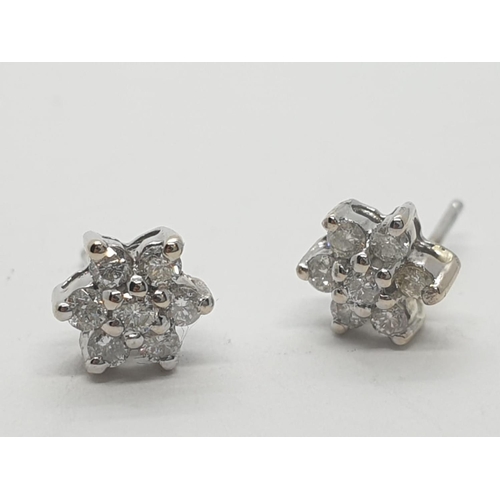 272 - 14ct white gold diamond stud earrings (no back)