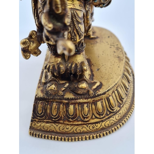 3 - A very early Oriental gilt on bronze statue of a fertility god, weight 2.25kg and 19cm tall approx