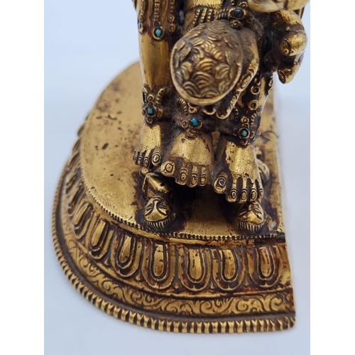 3 - A very early Oriental gilt on bronze statue of a fertility god, weight 2.25kg and 19cm tall approx