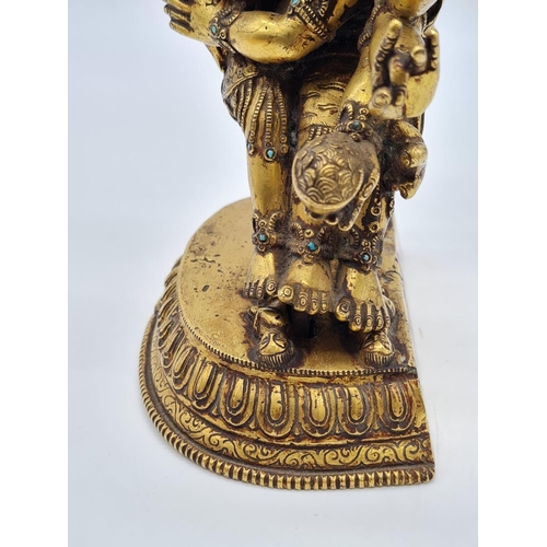 3 - A very early Oriental gilt on bronze statue of a fertility god, weight 2.25kg and 19cm tall approx