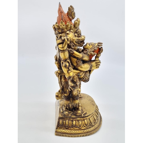 3 - A very early Oriental gilt on bronze statue of a fertility god, weight 2.25kg and 19cm tall approx