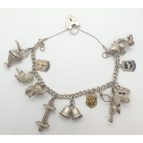 300 - Silver charm bracelet with 11 charms, some are opening up charms and heart padlock, weight 53.28g