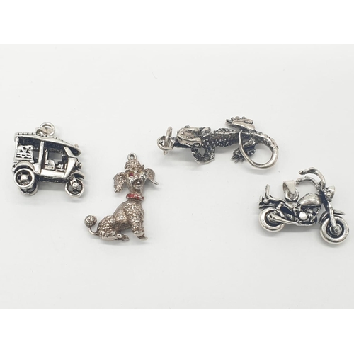 310 - 4x assorted silver pendants/charms of toy poodle, lizard and vehicles, weight 27.19g (4)