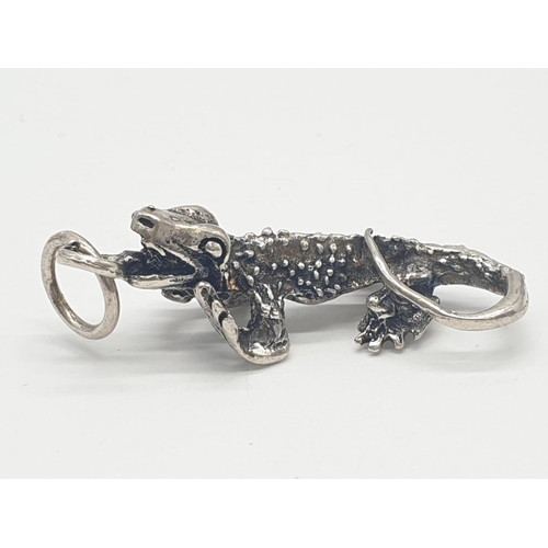 310 - 4x assorted silver pendants/charms of toy poodle, lizard and vehicles, weight 27.19g (4)