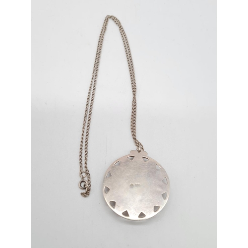 358 - Large silver round pendant with floral enamel designed on a 52cm long silver chain, pendant 4cm diam... 