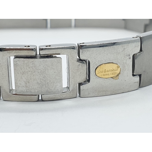 390 - Gent bracelet set in stainless steel and 18ct gold studs, 21.5cm long approx