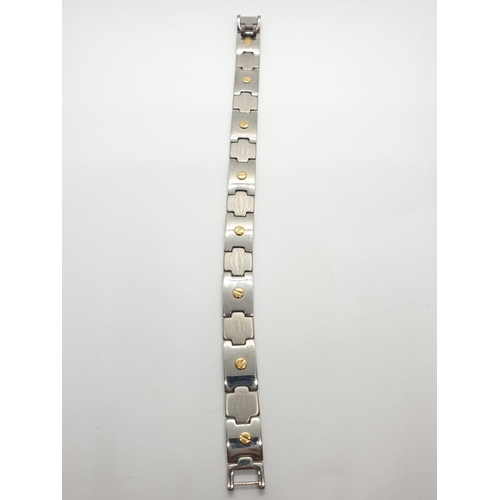 390 - Gent bracelet set in stainless steel and 18ct gold studs, 21.5cm long approx