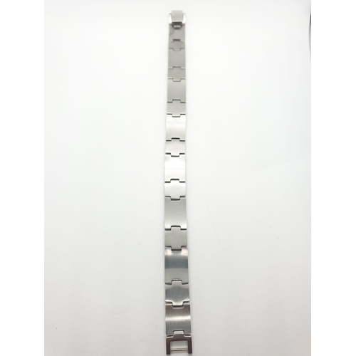 390 - Gent bracelet set in stainless steel and 18ct gold studs, 21.5cm long approx