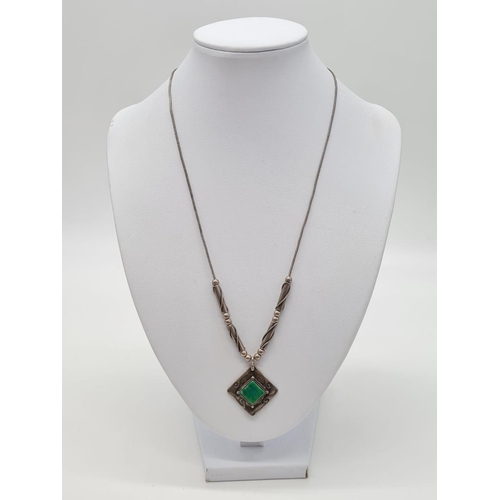 406 - Vintage emerald silver pendant set on 48cm long silver necklace, weight 13.86g and pendant 3cm appro... 