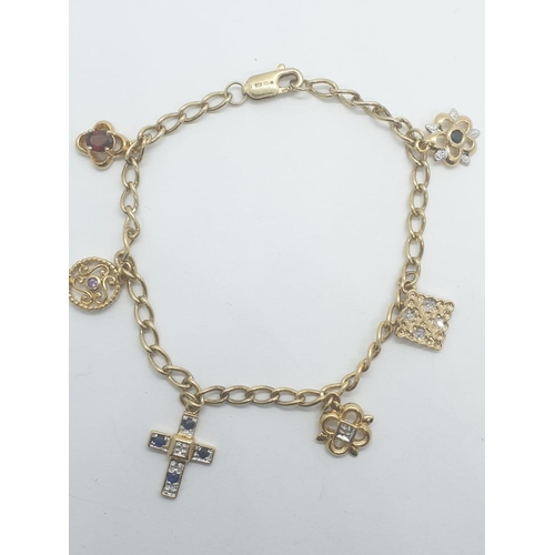 414 - Silver gilt (gold plated) charm bracelet with 6 stone set charms, weight 8.21g and 18cm long approx