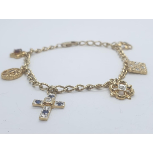 414 - Silver gilt (gold plated) charm bracelet with 6 stone set charms, weight 8.21g and 18cm long approx