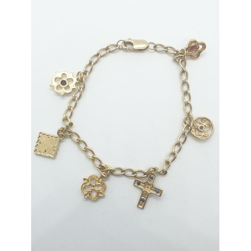 414 - Silver gilt (gold plated) charm bracelet with 6 stone set charms, weight 8.21g and 18cm long approx