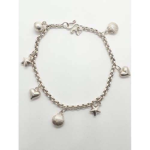 434 - Silver charm bracelet with 7 charms, weight 7.68g and 18cm long approx