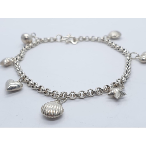 434 - Silver charm bracelet with 7 charms, weight 7.68g and 18cm long approx