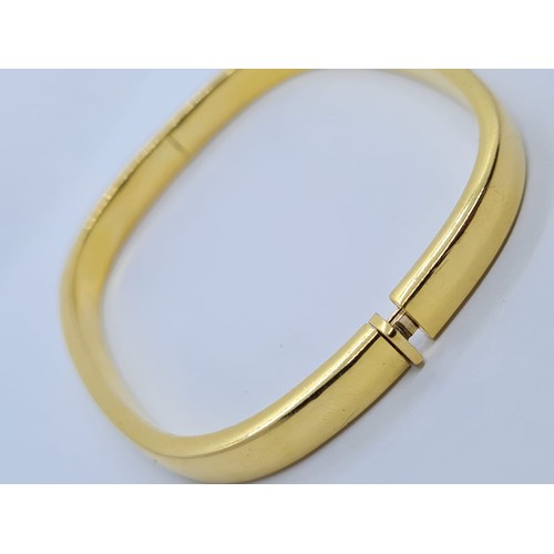 570 - 18ct gold bangle weight 16.7 grams size 6.5 x 5.5cm.