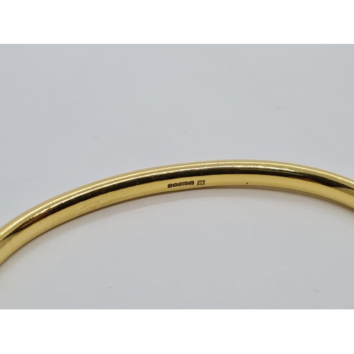 578 - 18ct gold bangle with six small diamonds in a Cartier style weighs 28gm.