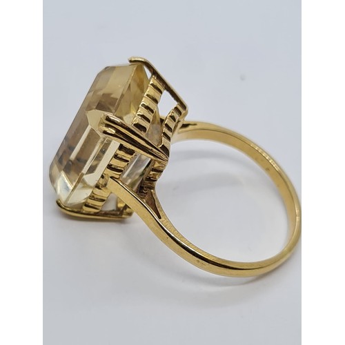 571 - 9ct dress ring with large citrine stone weight 6gm size is O.