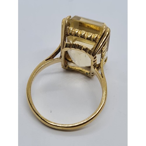 571 - 9ct dress ring with large citrine stone weight 6gm size is O.