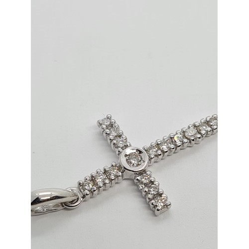 524 - 9CT WHITE GOLD DIAMOND SET CROSS 1.2g