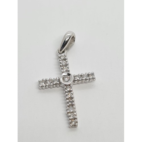 524 - 9CT WHITE GOLD DIAMOND SET CROSS 1.2g