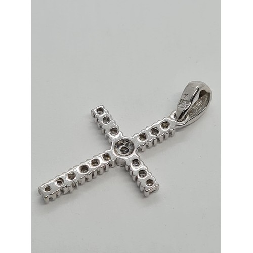 524 - 9CT WHITE GOLD DIAMOND SET CROSS 1.2g