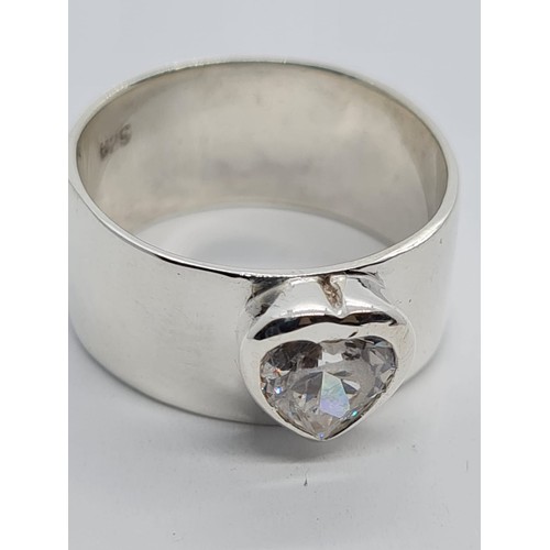 542 - STERLING SILVER WIDE CZ HEART SET BAND RING, WEIGHT 4.82G AND SIZE L/M