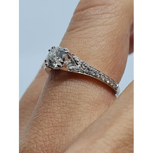 75 - 18CT WHITE GOLD ROUND BRILLIANT DIAMOND SOLITAIRE RING WITH DIAMOND SET SPLIT SHOULDERS, 0.60CT COLO... 