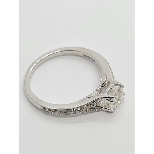 75 - 18CT WHITE GOLD ROUND BRILLIANT DIAMOND SOLITAIRE RING WITH DIAMOND SET SPLIT SHOULDERS, 0.60CT COLO... 