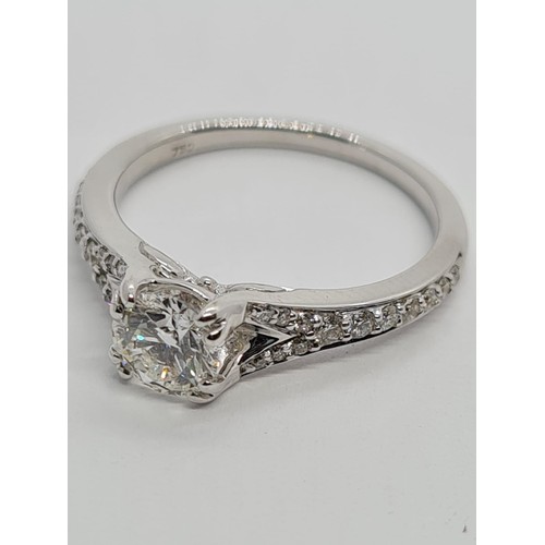 75 - 18CT WHITE GOLD ROUND BRILLIANT DIAMOND SOLITAIRE RING WITH DIAMOND SET SPLIT SHOULDERS, 0.60CT COLO... 