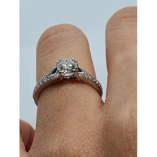 75 - 18CT WHITE GOLD ROUND BRILLIANT DIAMOND SOLITAIRE RING WITH DIAMOND SET SPLIT SHOULDERS, 0.60CT COLO... 