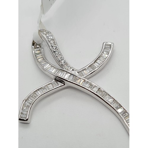 157 - 18CT WHITE GOLD DIAMOND SET CROSS, WEIGHT 2.2g AND 38MM LONG APPROX