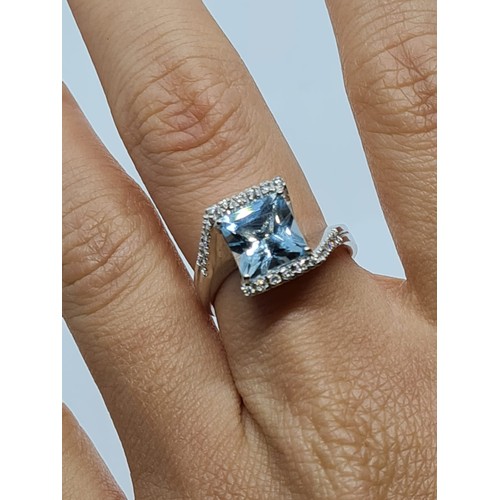 72 - 18ct white gold diamond & Aquamarine ring, weight 8.3g AND SIZE O, stone is 8x8mm approx