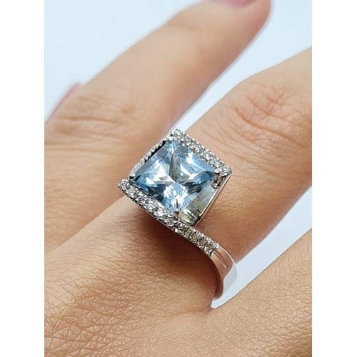 72 - 18ct white gold diamond & Aquamarine ring, weight 8.3g AND SIZE O, stone is 8x8mm approx