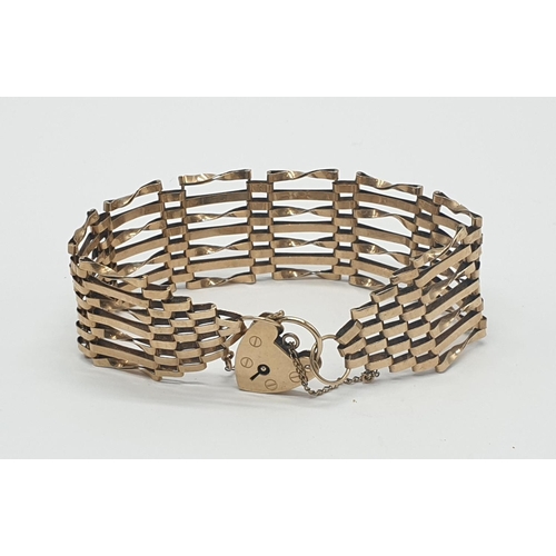 540 - 9ct gold gate bracelet with 7 rows and heart padlock, weight 14.6g and 18cm long approx