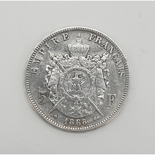 325 - Silver Napoleon III 1868 five franc coin, fine condition having clear and bold wording and images to... 