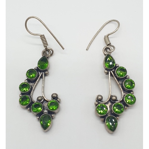 464 - Pair of silver stone set earrings having circular and pear shaped green diopside coloured stones in ... 