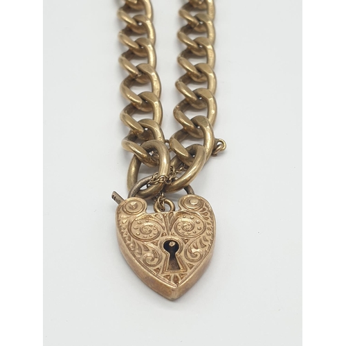 503 - Vintage 9ct gold bracelet with hand engraved heart padlock, weight 27.3g and 18cm long approx