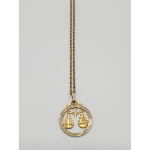 514 - 9ct gold pendant on a 56cm long gold chain, weight 5.2g