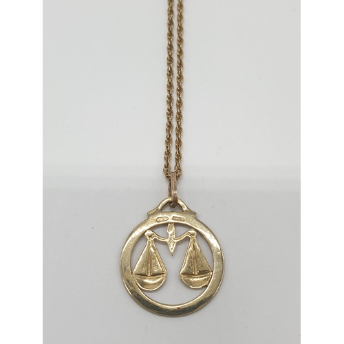 514 - 9ct gold pendant on a 56cm long gold chain, weight 5.2g