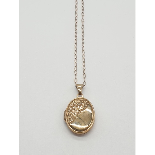 521 - 9ct locket on a 9ct gold 40cm long chain, weight 1.5g