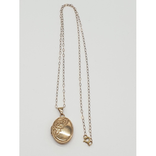 521 - 9ct locket on a 9ct gold 40cm long chain, weight 1.5g