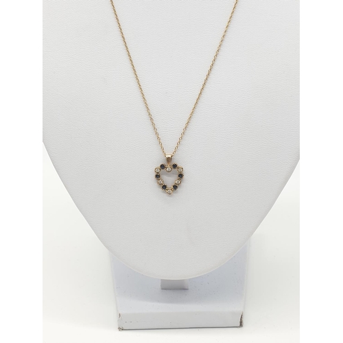 526 - A 9ct heart shaped pendant with blue and white stone on a 42cm long 9ct gold chain, weight 2.1g