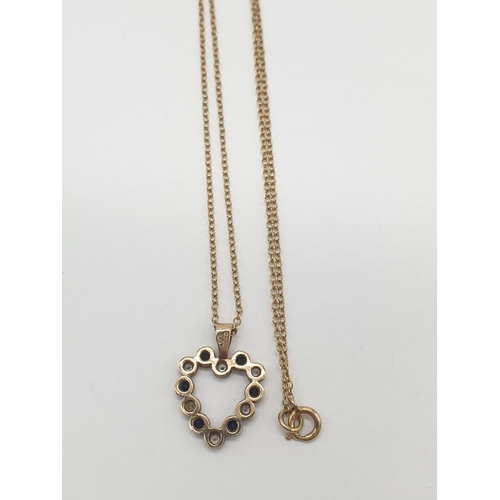 526 - A 9ct heart shaped pendant with blue and white stone on a 42cm long 9ct gold chain, weight 2.1g